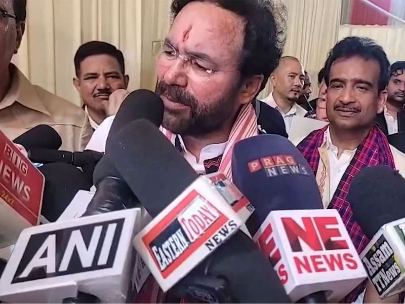 G. Kishan Reddy speaking into microphones from regional news channels of Assam and the North East, including Prag News and NE News